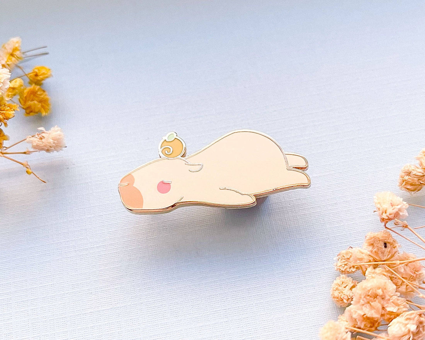 Curly the Capybara Lying Down Enamel Pin