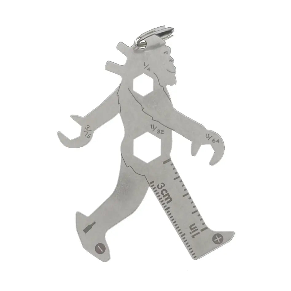 A silver metal multitool shaped like Bigfoot striding through the trees.