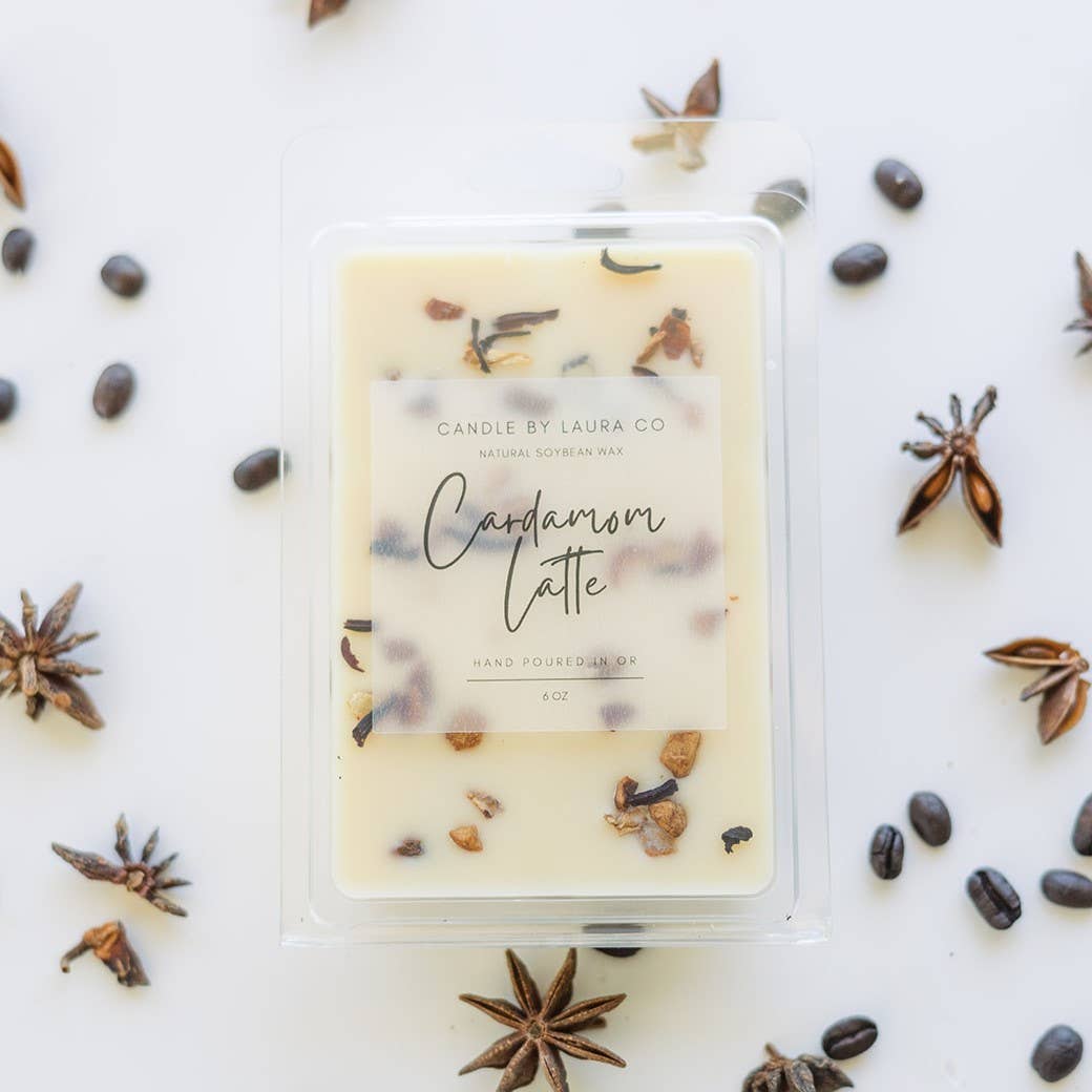 Image of the Cardamom Latte wax melt, an off-white wax decorated with dried spices.