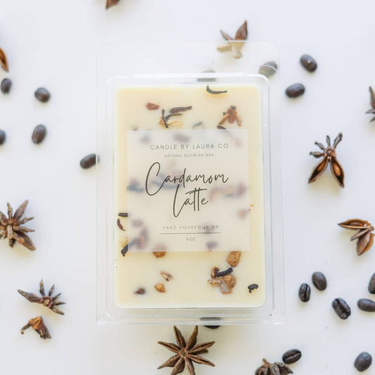 Image of the Cardamom Latte wax melt, an off-white wax decorated with dried spices.