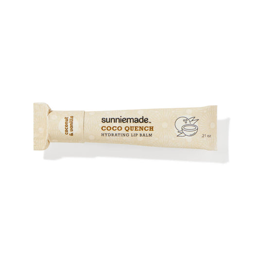 A renewable paper lip balm tube, labeled “Coco Quench Hydrating Lip Balm” against a white background.