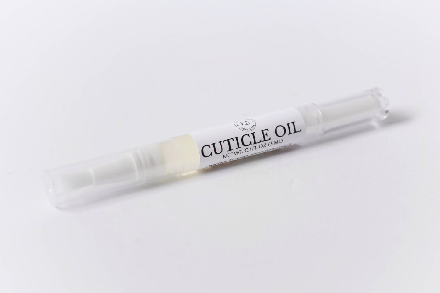 Image of a single cuticle oil pen against a white background.