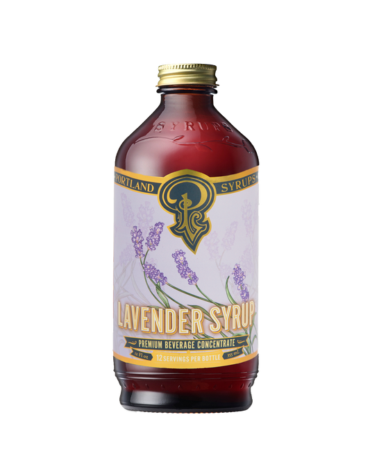 A dark glass bottle labeled “Portland Syrups - Lavender Syrup - Premium Beverage Concentrate”.