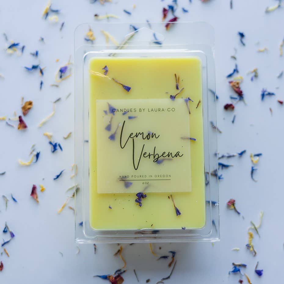 Image of the Lemon Verbena wax melt, a yellow wax with limonium petals suspended in it.