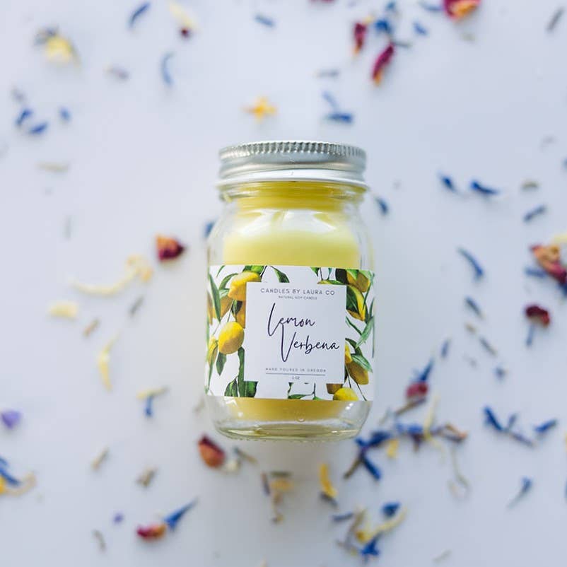 Image of the Lemon Verbena candle, a yellow candle in a miniature mason jar.