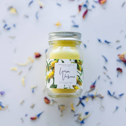 Image of the Lemon Verbena candle, a yellow candle in a miniature mason jar.