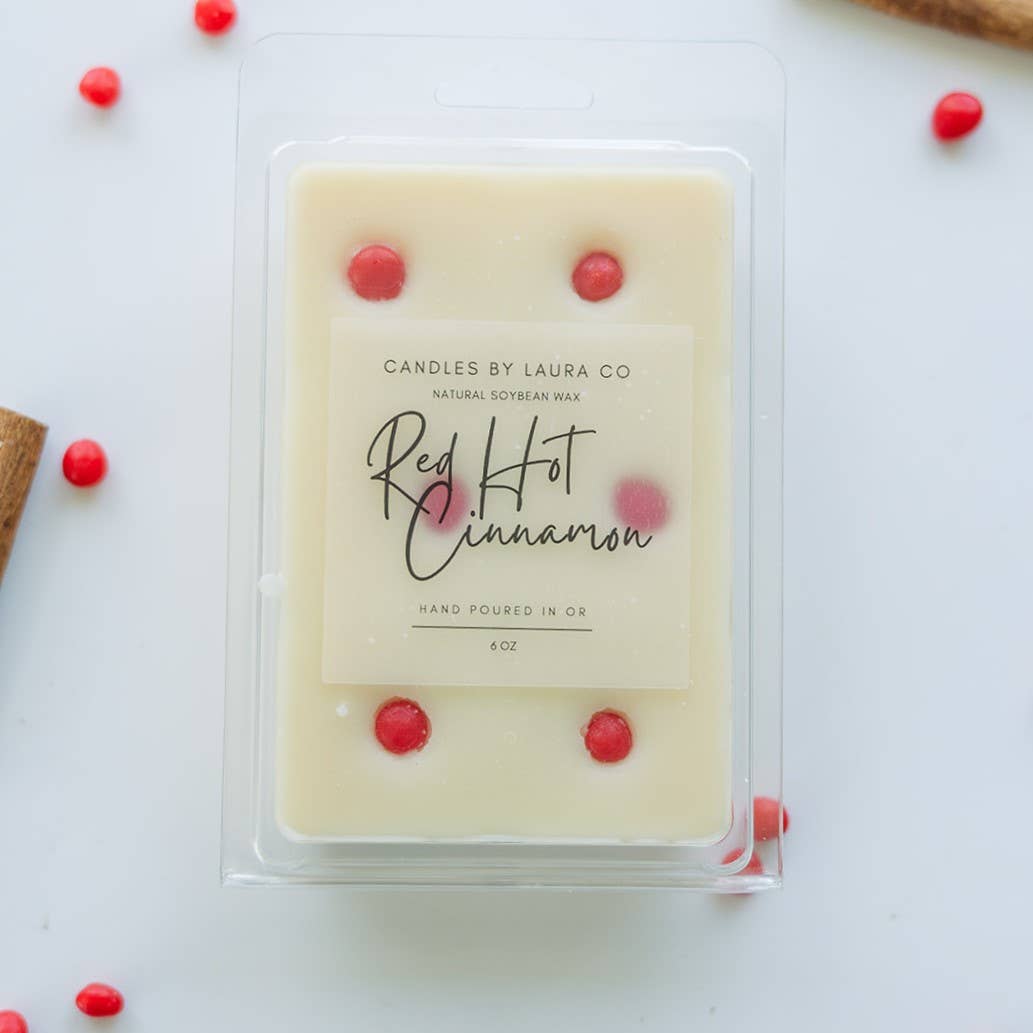 Image of the Red Hot Cinnamon wax melt, a white wax dotted with bright red pieces.