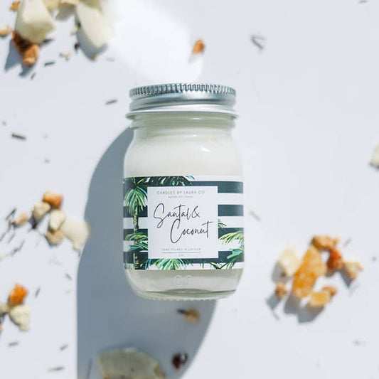 Image of the Santal & Coconut candle, a white candle in a miniature mason jar.