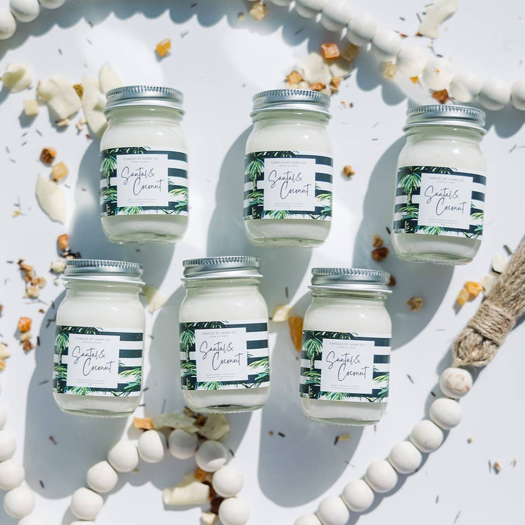 Image of six Santal & Coconut candles, white candles in miniature mason jars.
