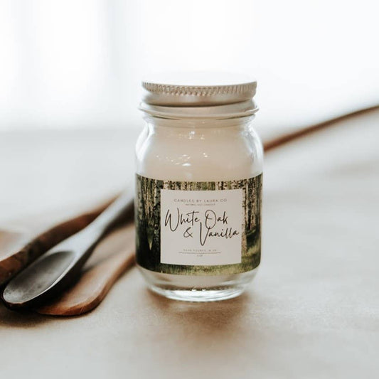 Image of the White Oak & Vanilla candle, a off-white candle in a miniature mason jar.