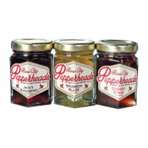 Three jars of Rose City Pepperheads jam on a white background
