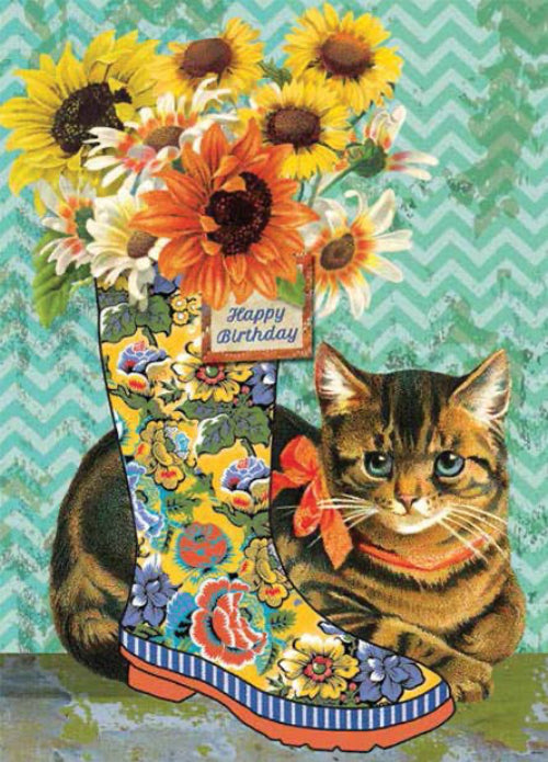 Cat with a colorful boot full of flowers and a 'Happy Birthday' sign on a chevron patterned background.